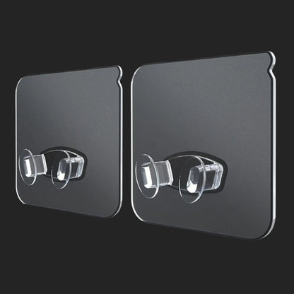 Two black adhesive strips with clear silicone hooks on a black background, labeled '10pcs'.