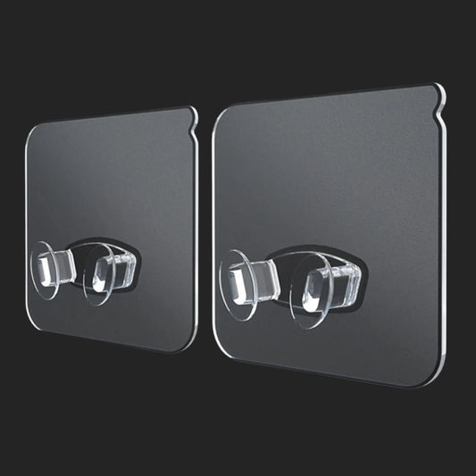 Two black adhesive strips with clear silicone hooks on a black background, labeled '10pcs'.