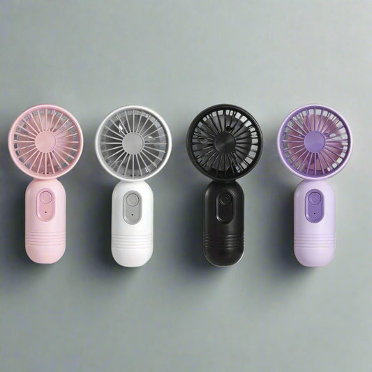 Four handheld fans in different colors on a white background