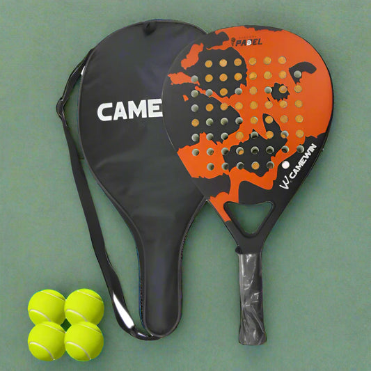Orange and black paddle with a black cover, three green tennis balls, and a clear plastic bag on a white background.