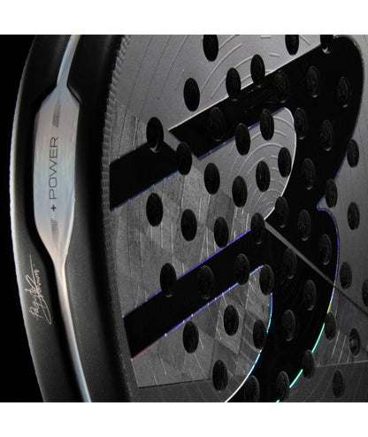 Close-up of Bullpadel Hack 04 Hybrid 18K aluminised carbon face